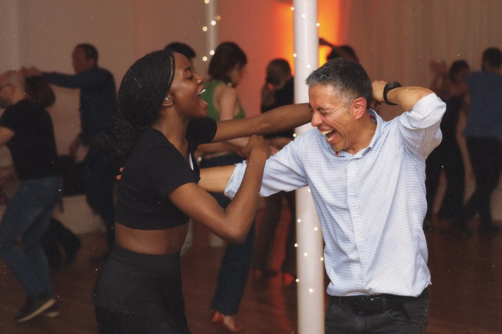 Couple laughing at Changó salsa social night Maida Vale